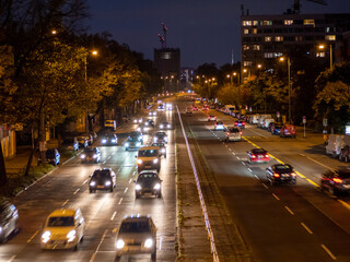 Fototapeta na wymiar light trails on a city highway. Night city.