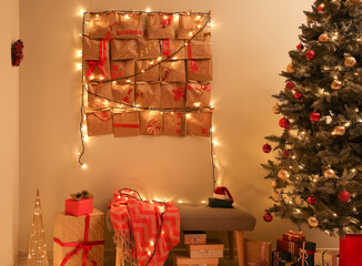 Christmas tree and advent calendar hanging on wall in room