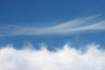 White clouds against the blue sky.