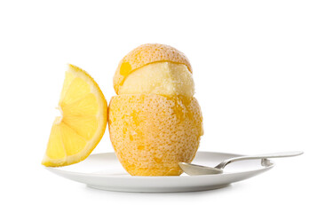 Plate with tasty ice cream in lemon peel on white background