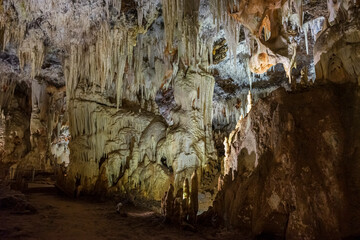 Formation of stalactites and stalagmites inside an ancient cave