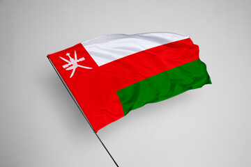 Oman flag isolated on white background. close up waving flag of Oman. flag symbols of Oman. Concept of Oman.