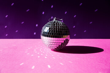 Fototapeta na wymiar disco ball on pink background. Christmas, birthday party 