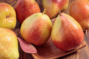 Still life with fresh pears on wooden table. Soft focus.