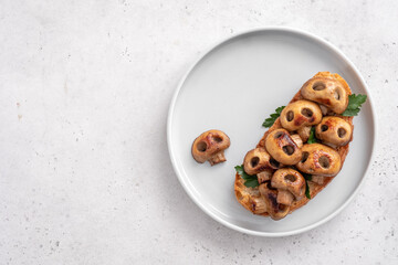 Halloween spooky pizza bread with skull-shaped mushrooms. Halloween lunch food