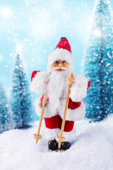 Christmas background with Samta Claus on ski in a winter landscape. Christmas greeting card. Winter time.