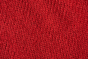 Red knitted wool texture background