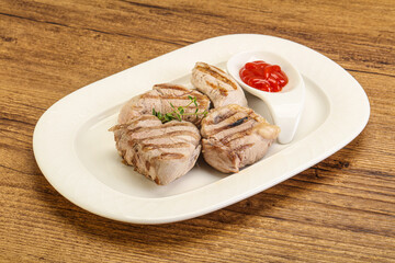 Grilled pork tenderlion with tomato sauce