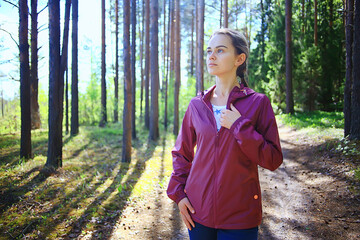 spring forest female windbreaker trekking, springtime rest nature landscape background woman tourist © kichigin19