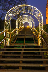 Wooden Stairs With Holiday Lights At Night