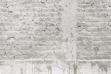 Texture of old brick wall sprayed with stucco mortar as background