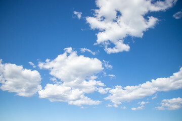 Obraz na płótnie Canvas Fluffy white clods in blue sky, Sardinia