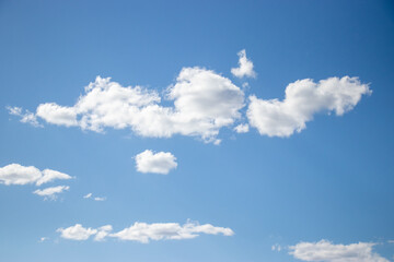 Fluffy white clods in blue sky, Sardinia