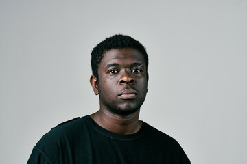 Obraz premium African man in black t-shirt fashion studio posing close-up