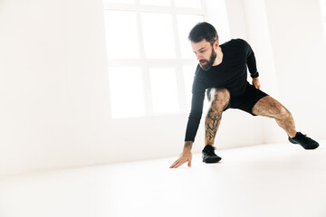 Fototapeta premium Confident mid aged white sportsman exercising