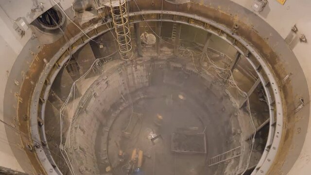 Three Gorges is a gravity dam hydroelectric station located on the Yangtze River in Hubei Province, China. The process of replacing an electric generator inside a dam. (time-lapse)