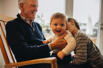 Elderly man with his two grandsons