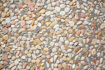 Stone antique old wall as a background or texture. Vintage background of a fortress wall in loft and grunge style with place for text and copy space.