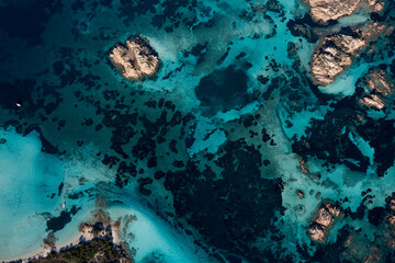 View from above, stunning aerial view of La Maddalena archipelago with some islands bathed by a turquoise and clear waters. Sardinia, Italy.