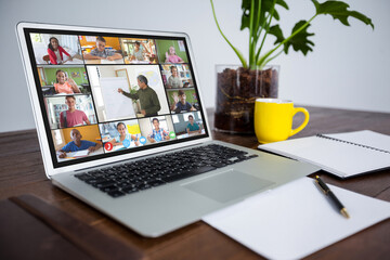 Fototapeta premium Smiling diverse elementary school pupils during class on laptop screen