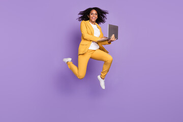 Photo of charming cute woman dressed yellow suit spectacles typing modern device isolated violet color background
