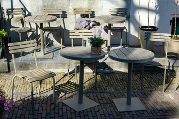 Vintage metal bistro table and chairs set in outdoor cafe