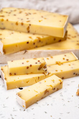 Cheese collection, matured cow cheese with mustard seeds from Belgium