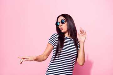Portrait of attractive long-haired cool girl dancing having fun pout lips isolated over pink pastel color background