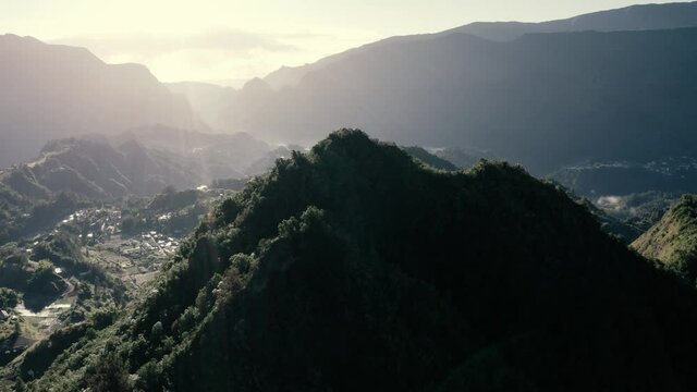Aerial view of beautiful township among the mountains of Hell Bourg, Saint Benoit, Reunion.
