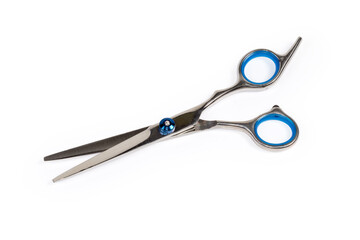 Professional stainless steel hairdressers scissors on a white background