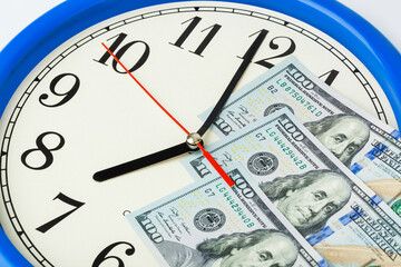 Clock and money - business concept