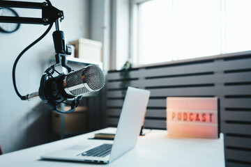 Local home podcast studio interior. Microphone, laptop and cozy streaming workplace