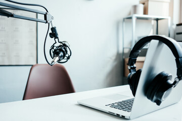Local podcast studio interior. Microphone, laptop, cozy streaming workplace