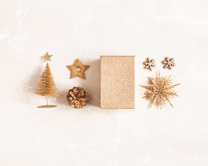Christmas composition. Golden decorations on marble beige background. Christmas, winter, new year concept. Flat lay, top view - 463562912