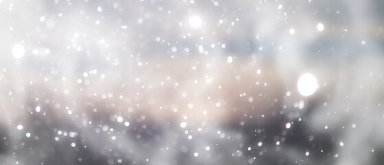 Obraz premium blue snowfall bokeh background, abstract snowflake background on blurred abstract blue