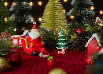 Santa claus on sleigh ride and various decor for christmas and new year concept.