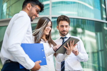 Business people using a tablet outdoor