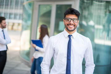 Fototapeta premium Businessman in front of a group of colleagues, teamwork concept