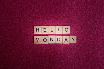 Hello Monday wooden letter alphabet on bright pink background