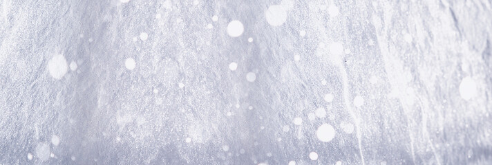 The texture of the snow. Winter rainfall. Tracks on a snowy road after a snowfall.