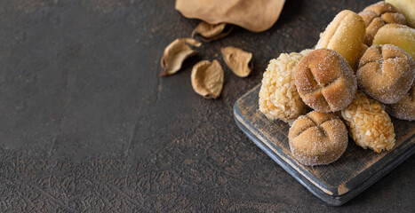 Different shape Panellets, Catalan small cakes or cookies consumed at Castanyada (All Saints Day), in Catalonia, Spain.Lage image for banner