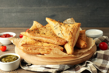 Concept of tasty food with samsa on wooden table
