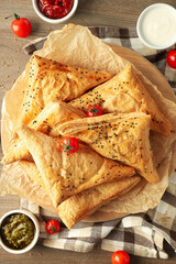 Concept of tasty food with samsa on wooden background