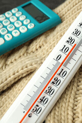 Concept of heating season with thermometer, close up