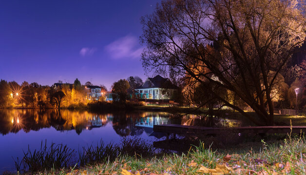 Moscow. October 15, 2021. Golden autumn in Meshchersky Park at night, illuminated by moonlight and street lamps.