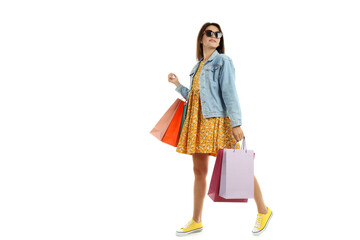 Girl with multicolored paper bags isolated on white background