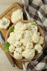 Concept of tasty food with cauliflower on wooden background