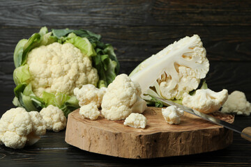 Concept of tasty food with cauliflower on wooden background