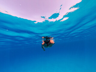 Underwater photo freediver swim in clear sea