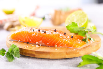 raw salmon fish fillet and herbs
